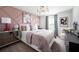 Stylish bedroom featuring unique art, comfortable furnishings, and a trendy design at 1233 Tidal St, Haines City, FL 33844
