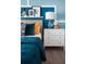 Cozy bedroom featuring stylish decor, a comfortable bed, and colorful accents at 1233 Tidal St, Haines City, FL 33844