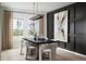 Elegant dining room with modern lighting, stylish chairs, and a sophisticated aesthetic at 1233 Tidal St, Haines City, FL 33844