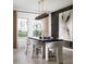 Refined dining room showcasing modern decor, stylish furniture, and natural light at 1233 Tidal St, Haines City, FL 33844