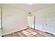 Sunlit bedroom with wood-style flooring, neutral walls, and a closet for storage at 2572 Robert Trent Jones Dr # 1235, Orlando, FL 32835
