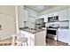 Modern kitchen featuring stainless steel appliances and granite countertops for a gourmet experience at 2572 Robert Trent Jones Dr # 1235, Orlando, FL 32835