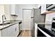 Tasteful kitchen featuring stainless steel appliances, granite countertops, and white cabinetry at 2572 Robert Trent Jones Dr # 1235, Orlando, FL 32835