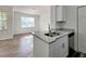 Living space with a granite countertop bar for eat-in dining, providing a relaxed atmosphere at 2572 Robert Trent Jones Dr # 1235, Orlando, FL 32835