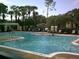A community pool invites relaxation with its crystal-clear water and sun-drenched lounging areas at 2572 Robert Trent Jones Dr # 1235, Orlando, FL 32835