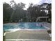 A serene community pool invites relaxation with its crystal-clear water and sun-drenched lounging areas at 2572 Robert Trent Jones Dr # 1235, Orlando, FL 32835