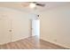 Neutral bedroom with wood-look floors, white trim, and multiple closets, offering ample space at 2586 Robert Trent Jones Dr # 1124, Orlando, FL 32835
