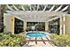 Inviting hot tub with pergola, surrounded by lush landscaping at 2586 Robert Trent Jones Dr # 1124, Orlando, FL 32835