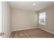 Bedroom featuring plush carpeting, a window with blinds, and neutral colored walls at 4106 Gerbera Daisy Ave, Lake Hamilton, FL 33851