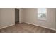 Bedroom featuring plush carpeting, a window with blinds, and neutral colored walls at 4106 Gerbera Daisy Ave, Lake Hamilton, FL 33851