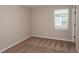 Bedroom featuring plush carpeting, a window with blinds, and neutral colored walls at 4106 Gerbera Daisy Ave, Lake Hamilton, FL 33851