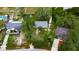 Aerial view of a single Gathering home with mature landscaping and a generous lot surrounded by lush greenery at 4854 Myrtle View N Dr, Mulberry, FL 33860