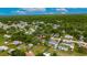 Aerial view of neighborhood homes, trees, and landscaping with a red marker on the property at 4854 Myrtle View N Dr, Mulberry, FL 33860