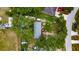 Aerial view of a single story home with a nice treed yard and plenty of parking at 4854 Myrtle View N Dr, Mulberry, FL 33860