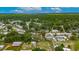 Aerial view of neighborhood with home, tree coverage and landscaping marked with red pin at 4854 Myrtle View N Dr, Mulberry, FL 33860