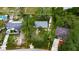 Aerial view of a single Gathering home with mature landscaping and a generous lot surrounded by lush greenery at 4854 Myrtle View N Dr, Mulberry, FL 33860