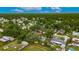 Aerial view of single story home surrounded by mature trees in a neighborhood setting at 4854 Myrtle View N Dr, Mulberry, FL 33860