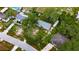 Aerial shot of a residence surrounded by trees, showcasing its serene setting at 4854 Myrtle View N Dr, Mulberry, FL 33860