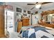 Bright bedroom featuring quilt bed and ensuite bathroom at 4854 Myrtle View N Dr, Mulberry, FL 33860