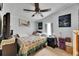 Cozy bedroom with ceiling fan, neutral walls, and comfortable decor at 4854 Myrtle View N Dr, Mulberry, FL 33860