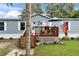Charming single-story home with light blue siding and a cozy front porch at 4854 Myrtle View N Dr, Mulberry, FL 33860