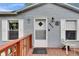 Charming front porch with wooden deck and light blue siding creates a welcoming exterior at 4854 Myrtle View N Dr, Mulberry, FL 33860