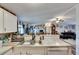 Bright kitchen featuring a stainless steel sink and marble countertops at 4854 Myrtle View N Dr, Mulberry, FL 33860