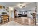 Open-concept living space with a comfortable seating area, a work station, and wood-look flooring at 4854 Myrtle View N Dr, Mulberry, FL 33860