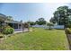 A beautiful backyard with lush green grass, a privacy fence, and a nice outdoor space at 5316 Dorman Rd, Lakeland, FL 33813
