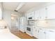 This kitchen boasts white appliances, ample cabinet space, and light wood floors for a clean, modern look at 5316 Dorman Rd, Lakeland, FL 33813