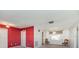 Open living room with neutral carpet, window, and doorway to other rooms at 5316 Dorman Rd, Lakeland, FL 33813