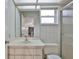 Bathroom featuring a sink with cabinets and a shower with glass doors at 1034 Brighton Way, Lakeland, FL 33813