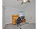 Bedroom offering a ceiling fan, desk space, closet, and neutral carpet at 1034 Brighton Way, Lakeland, FL 33813