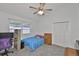 Cozy bedroom features a window, ceiling fan, closet and workspace creating a comfortable space at 1034 Brighton Way, Lakeland, FL 33813