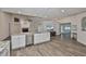 Open concept kitchen island with breakfast bar and stainless steel dishwasher at 1034 Brighton Way, Lakeland, FL 33813