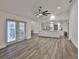 Spacious living room with an open floor plan and bright, airy atmosphere is enhanced by the kitchen at 1034 Brighton Way, Lakeland, FL 33813