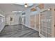 Bright sun room with skylights, tile floors, ceiling fan, and French doors at 1034 Brighton Way, Lakeland, FL 33813