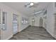 Sun room with tile floors, ceiling fan, and French doors overlooking pool at 1034 Brighton Way, Lakeland, FL 33813
