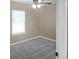 Comfortable bedroom featuring soft carpeting, a large window for natural light, and neutral wall colors at 5969 Nw 65Th St, Ocala,, FL 34482