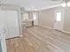 Spacious living area with stylish laminate flooring, freshly painted walls, and an abundance of natural light at 5969 Nw 65Th St, Ocala,, FL 34482