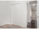 Bedroom featuring a closet with bi-fold doors and views into the hall at , Kissimmee, FL 34758