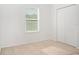 Bedroom featuring carpeted floors, base molding, a double door closet, and window with blinds at , Kissimmee, FL 34758