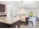 The kitchen features an island with granite countertops, stainless appliances, and dining area at , Kissimmee, FL 34758