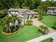 An aerial view of the beautiful home with a paver driveway and complemented by mature landscaping and trees at 2242 Soaring Eagle Pl, Lake Mary, FL 32746