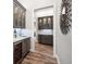 Stylish bar area with wine fridge, granite counters, and elegant glass-front cabinets, great for entertaining at 2242 Soaring Eagle Pl, Lake Mary, FL 32746
