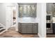 Butler's pantry featuring custom cabinetry with glass displays and marble countertops at 2242 Soaring Eagle Pl, Lake Mary, FL 32746