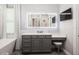 This bathroom includes a single sink vanity, a soaking tub, and an LED mirror at 2242 Soaring Eagle Pl, Lake Mary, FL 32746