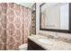 Bathroom featuring framed mirror, decorative shower curtain, granite countertop, and tiled floor at 2242 Soaring Eagle Pl, Lake Mary, FL 32746