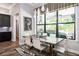 Bright dining room with contemporary furnishings and a large window at 2242 Soaring Eagle Pl, Lake Mary, FL 32746
