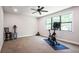 Bright exercise room with modern stationary bike, neutral tones, and a large window at 2242 Soaring Eagle Pl, Lake Mary, FL 32746